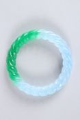 A CHINESE TWO-TONE JADE BANGLE. 3ins diameter. 50grams.