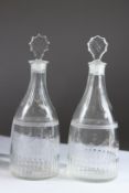 A GOOD PAIR OF GEORGE III DECANTERS AND STOPPERS. 23cms high.