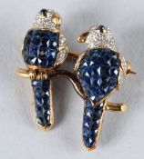 AN 18CT GOLD, DIAMOND AND SAPPHIRE BIRD BROOCH.