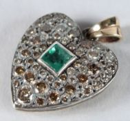 A VICTORIAN DIAMOND AND EMERALD HEART SHAPED PENDANT.