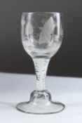 AN 18TH CENTURY DUTCH WINE GLASS with white twist stem and engraved bowl. 16cms high.