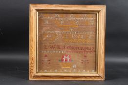 A FRAMED NEEDLEWORK SAMPLER L. W. NICHOLSON Aged 12. 10ins x 10ins.