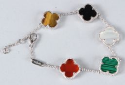 A SILVER CLOVER BRACELET.