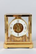 A JAEGER-LECOULTRE ATMOS CLOCK in a glass case. 23cms high.