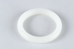 A GOOD WHITE JADE BANGLE. 8cms diameter.