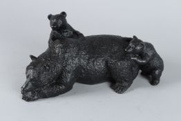 A BRONZE GROUP OF THREE BEARS. 22cms high.