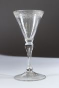 AN 18TH CENTURY BALUSTER WINE GLASS, the rim engraved with birds. 15cms high.