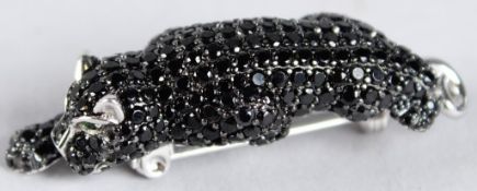 A SILVER LEOPARD BROOCH.
