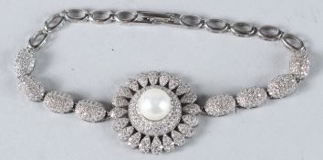 A PEARL AND CZ BRACELET.