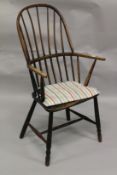 A COUNTRY MADE WINDSOR SPINDLE BACK ARMCHAIR.