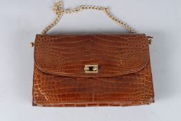 A VINTAGE CROCODILE TAN BAG. 9ins.