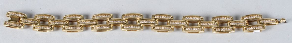 A GOOD HEAVY 9CT GOLD CURB LINK DIAMOND SET BRACELET. 85 grams.