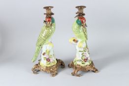 A GOOD PAIR OF GREEN PORCELAIN STICKS with gilt metal mounts. 35cms high.