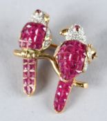 AN 18CT GOLD, DIAMOND AND RUBY BIRD BROOCH.