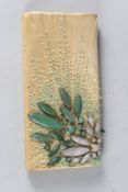 A SILK CLUTCH BAG with jade flowers by SHANGHAI TANG.