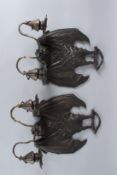 A GOOD PAIR OF BRONZE BATWING WALL SCONCES with two scrolling arms. 30cms high.