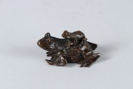 A BRONZE GROUP OF TWO FROGS. 7cms.