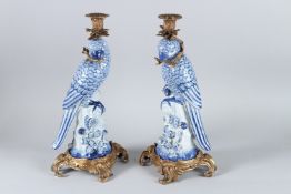 A GOOD PAIR OF BLUE AND WHITE PORCELAIN STICKS with gilt metal mounts. 35cms high.