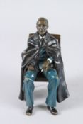 L. PLET. A BRONZE OF A MAN SEATED IN A CHAIR. Signed.