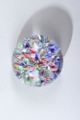 A SMALL BACCARAT MILLEFIORI GLASS PAPERWEIGHT. 5cms diameter.
