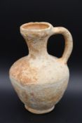 AN ANCIENT TERRACOTTA PITCHER. 5.5ins high.
