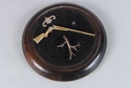 A SILVER GILT DOUBLE BARREL SHOTGUN, 15cms long, Birmingham 1964, and a branch, both in a glass