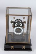 A GOOD GRASSHOPPER CLOCK in a glass case, the base with a drawer.