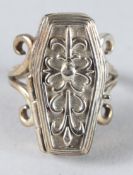 A SILVER COFFIN RING.
