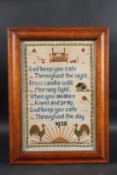 A FRAMED NEEDLEWORK SAMPLER 1922. 14ins x 9ins.