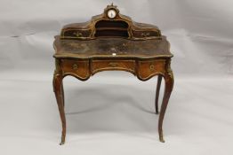 A LOUIS XVI STYLE KINGWOOD LIBRARY WRITING TABLE with ormolu mounts, leather writing surface, the