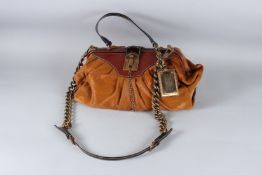 A DOLCE & GABBANA WOMEN'S COLLECTION LEATHER AND TAN HANDBAG. 40cms high.