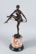AFTER D. ALONZO. A bronze hoop dancer. Signed. 34cms high, on a marble base.