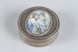 A GOOD 18TH CENTURY FRENCH SILVER CIRCULAR BOX AND COVER, the lid with an ivory panel painted with