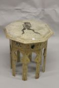 AN ISLAMIC DESIGN OCTAGONAL TABLE by DAVID MLINARIC, CIRCA. 1960, the top and sides painted with