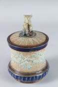 A DOULTON LAMBETH STONEWARE TOBACCO JAR AND COVER, the lid with a Tinworth mouse. 17cms high.