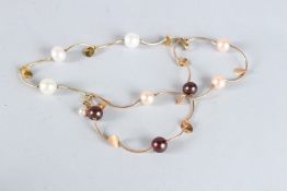 AN 18CT YELLOW GOLD AND PEARL LEAF BRACELET.