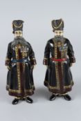 A PAIR OF RUSSIAN BRONZE COSSACK MEN. 18cms high.