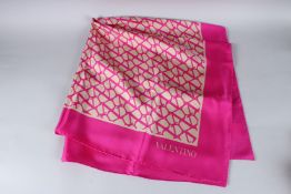 A VALENTINO SILK SCARF. 80cms x 80cms, in a Valentino's box.