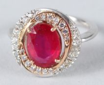 A GOOD 18CT WHITE GOLD, RUBY AND DIAMOND CLUSTER RING.