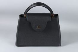 A GOOD LOUIS VUITTON BLACK LEATHER BAG. 34cms wide, in a Louis Vuitton dust cover.
