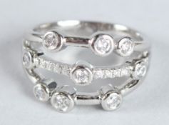 AN 18CT WHITE GOLD AND DIAMOND BAUBLE RING.