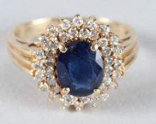 A 14CT GOLD, DIAMOND AND SAPPHIRE CLUSTER RING.