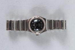 A LADIES OMEGA STAINLESS STEEL CONSTELLATION DIAMOND SET WATCH with blue dial, in an Omega box.