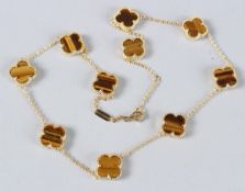 A SILVER AND MULTI STONE CLOVER BRACELET.