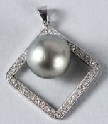 AN EDWARDIAN SOUTH SEA PEARL AND DIAMOND PENDANT.