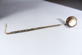 A LONG HANDLED GEORGIAN SILVER TODDY LADLE.