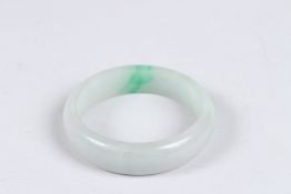 A PLAIN JADE BANGLE.
