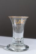 AN 18TH CENTURY MASONIC FIRING GLASS with engraved bowl. 10cms high.