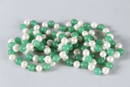 A STRING OF JADE AND PEARL BEADS. 100cms long.