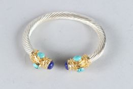 A SILVER GILT AND LAPIS BANGLE.